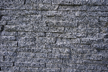 Fototapeta premium wall from natural granite in the form of a brick
