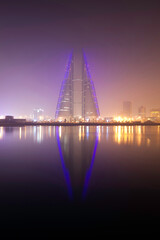 Fototapeta premium The Bahrain skyline during fog with beautiful scattered hue, a view from Bahrain bay