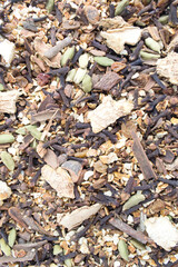 Background from spices for mulled wine. A scattering of seasonings from orange, cinnamon, cardamom