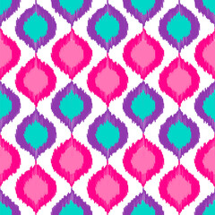 Seamless vector pattern with ikat diamonds in bright color palette.