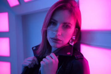 Futuristic style portrait in blue and purple light.