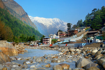 View of Gangotri town with mountains and holy ganga river. Uttarakhand, India.