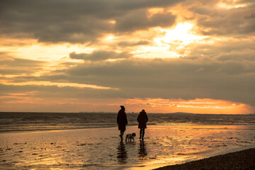 Family walk along the coast
