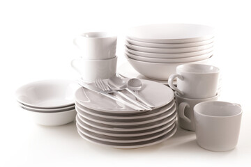 set of clean dishes on white background