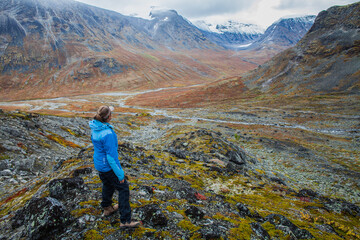 A young woman hiking in the mountains in Jotunheimen, Norway