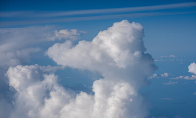 Naklejka na ściany i meble Above the clouds aerial view 