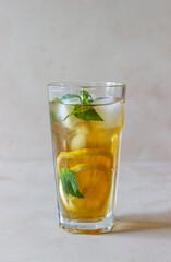 Cold tea with lemon and mint. A summer drink. Healthy eating. Vegetarian food. Diet.