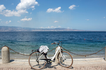 Panoramic view of reggio calabria's sea in the evening. From here is possible see Sicilia in...