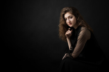 Studio portrait of a beautiful girl on a black background
