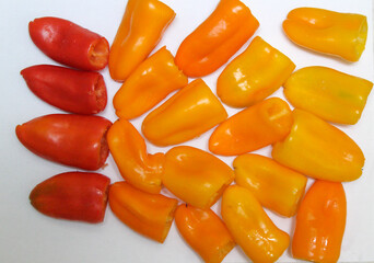 Multicolored sweet peppers on a white background