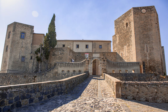 Close up medieval castle of Melfi. Medieval southern italian castle in close up and a blue clear sky in background. The castle is in stone bricks and have two towers.