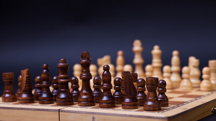 A game of chess, the beginning of a chess game two sides opposite each other.