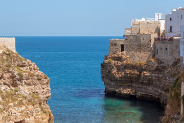 Fototapeta na wymiar Summer in Polignano a mare. View of Puglia' sea, near Bari. Panoramic view of sea polignano a mare, a city in Puglia ( apulia) during a sunny day. It is a very perfect turist destination in the summe