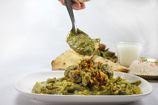 Cluster Beans Curry-Gwar ki Sabzi served with rice roti and Papad.selective focus.