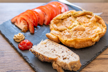 breakfast with eggs, tomatoes and bread