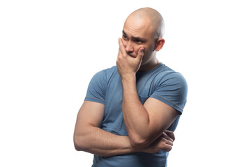 Photo of young bald man with problems in blue tee shirt