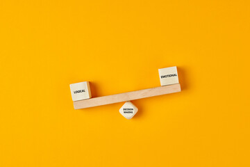 Using logic rather than emotions in business decision making. Wooden blocks designed as a seesaw with logical and emotional text written. - obrazy, fototapety, plakaty