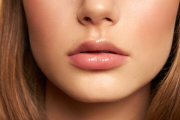 Beauty makeup. Woman face. Macro close-up nude lips 