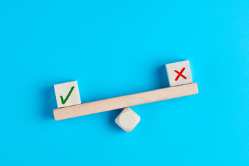 Concept of positive evaluation in decision making, approval or voting. Tick mark outweighs cross...