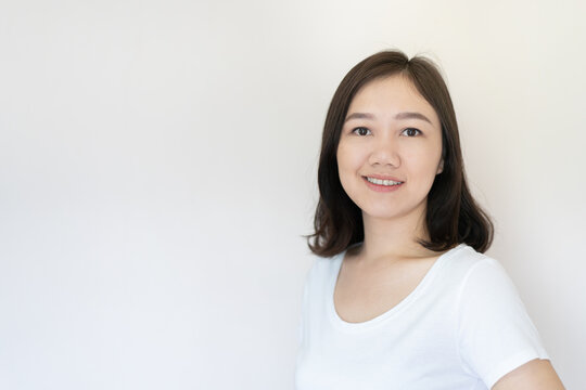 Portrait Of Asian Beautiful Woman Age Around 25 - 30 Years Old On White Background With Copy Space. 