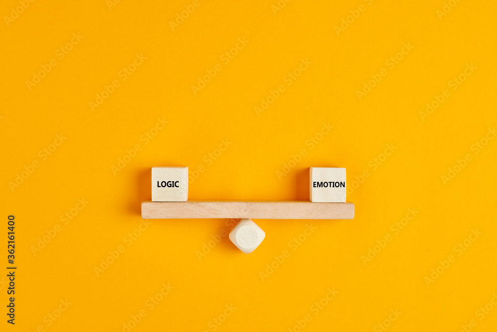 Poster wooden blocks designed as a seesaw with the concepts of logic and emotion are in balance