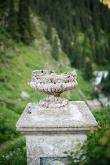 Old ruined antique concrete flower pot garden vase