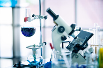 Blue color liquid chemical in a experimental glass wear in the laboratory close up with copy space....