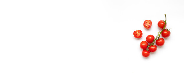 Fresh cherry tomatoes on a branch isolated on a white background with copy space, flat lay