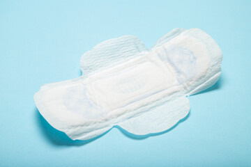 Feminine pads on a blue background. Menstruation. Gynecology. Women Health