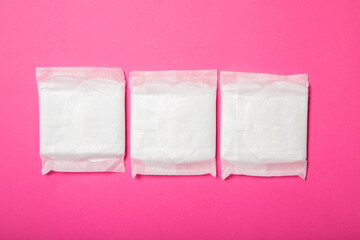 Women's pads on a pink background.Women Health. Intimate hygiene. View from above