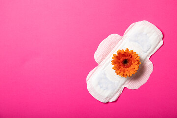 Feminine pads and gerbera on a pink background. Women Health