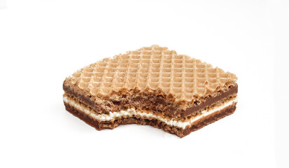 Bitten chocolate and milk wafer isolated on white background. Square shaped food snack