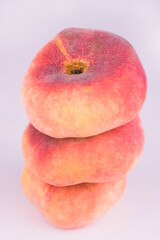 
Three fig peaches on a white background.Close-up.
