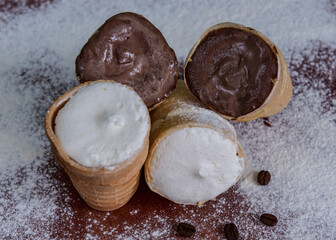 Chocolate and cream ice cream in a glass. Cold dessert Brown and white ice cream 