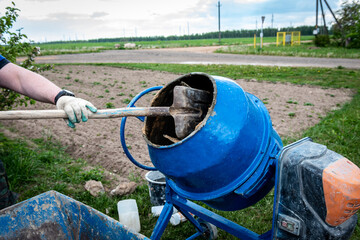 The preparation of the concrete mortar in concrete mixer.