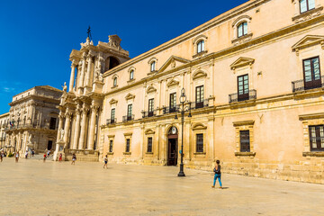 Fototapeta premium A view along the side of Piazza Duomo on Ortygia island, Syracuse, Sicily in summer