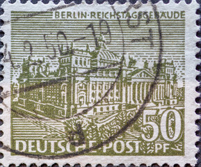 GERMANY, Berlin - CIRCA 1949: a postage stamp from Germany, Berlin showing Berlin buildings: Berlin Reichstag building in olive green