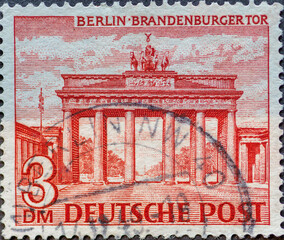 GERMANY, Berlin - CIRCA 1949: a postage stamp from Germany, Berlin showing Berlin buildings: The Brandenburg Gate in red