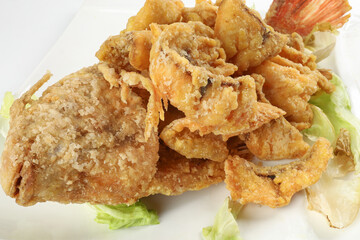 Deep fried freshwater red whole tilapia fish sliced fillet