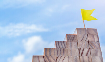 staircase and yellow flag on sky background