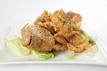 Deep fried freshwater red whole tilapia fish sliced fillet