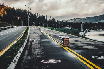 Mountain road. Landscape with dramatic overcast sky, beautiful asphalt road. Travel background....