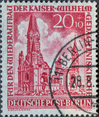 GERMANY, Berlin - CIRCA 1953: a postage stamp from Germany, Berlin showing the Kaiser Wilhelm Memorial Church on Breitscheidplatz after its destruction in World War II. Color: red