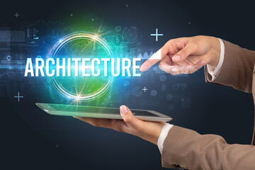 Close-up of a touchscreen with ARCHITECTURE inscription, new technology concept