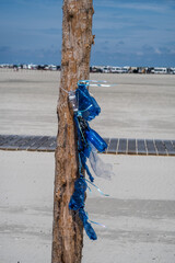 Blue plastic bottles hanging in the wind