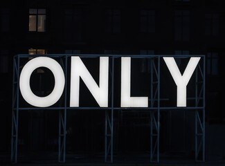 word ONLY glowing letters on a metal frame