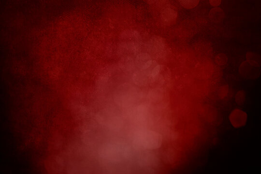 Dark red grungy christmas background with glitter bokeh lights