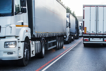 Trucks in a traffic jam on a suburban highway.
