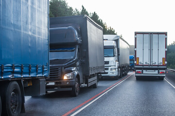 Trucks in a traffic jam on a suburban highway.