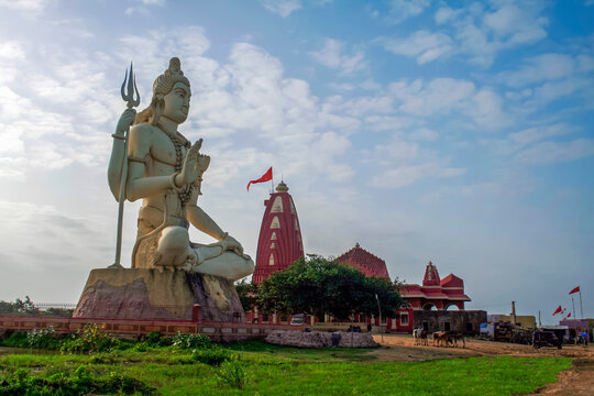 Giant sculpture of Shiva Nageshwar at the famous Nageshwar temple close to Dwarka. Gujarat. India.